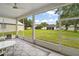 Spacious screened patio with scenic backyard views, perfect for outdoor relaxation and entertaining at 3800 Woodleaf Ct, Leesburg, FL 34748