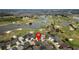 Aerial view of a home by a golf course, offering stunning views and easy access to recreational amenities at 3942 Zenith Loop, The Villages, FL 32163
