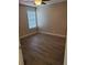 Bedroom with hard wood floors, neutral walls, and a large window at 420 Forestway Cir # 206, Altamonte Springs, FL 32701