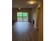 Open living room with sliding doors to a deck and a cozy fireplace at 420 Forestway Cir # 206, Altamonte Springs, FL 32701