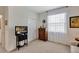 Bedroom features neutral walls, carpet, and a large window, creating a peaceful retreat at 4247 James River Cir, Leesburg, FL 34748