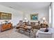 Cozy living room featuring neutral walls, tile floors, and comfortable furnishings for a welcoming ambiance at 4247 James River Cir, Leesburg, FL 34748