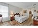 Bedroom featuring a hardwood floors, white walls, and a large window at 4247 James River Cir, Leesburg, FL 34748