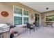 Charming outdoor patio area with BBQ grill and comfortable seating for enjoying the outdoor space at 4247 James River Cir, Leesburg, FL 34748