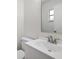 Bathroom featuring a modern vanity with white countertop, sink, toilet and mirror at 425 Marion Oaks Dr, Ocala, FL 34473
