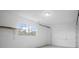 Clean and bright two car garage with painted walls and a single window for natural light at 425 Marion Oaks Dr, Ocala, FL 34473