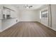 Spacious living room with wood-look floors, neutral paint, and window at 425 Marion Oaks Dr, Ocala, FL 34473
