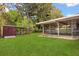 A lush backyard offers a shed with plenty of room for storage at 4251 Magnolia Ave, Leesburg, FL 34748