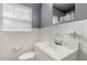 A classic bathroom is adorned with white tiles, a modern sink, and neutral walls at 4251 Magnolia Ave, Leesburg, FL 34748