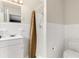 Bright bathroom with white tiled walls, a classic sink vanity and a shower area at 4251 Magnolia Ave, Leesburg, FL 34748