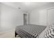 This cozy bedroom is enhanced by neutral colors and a convenient closet at 4251 Magnolia Ave, Leesburg, FL 34748