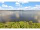Panoramic lake view featuring calm waters, treeline horizon, and blue skies at 4251 Magnolia Ave, Leesburg, FL 34748