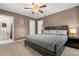 Spacious main bedroom featuring a patterned bedspread and an en-suite bathroom, creating a private retreat at 4251 Magnolia Ave, Leesburg, FL 34748