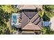 A birds-eye view of the property highlighting the backyard pool and screen enclosure amid mature landscaping at 4328 Acorn Ct, Davenport, FL 33837