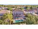 Aerial view of home featuring screened pool, lush landscaping, and proximity to neighborhood amenities at 4328 Acorn Ct, Davenport, FL 33837