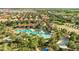 Aerial view of resort style community with pool and many amenities at 4328 Acorn Ct, Davenport, FL 33837