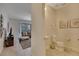Cozy half bathroom featuring neutral tones, pedestal sink, and decorative wall art at 4328 Acorn Ct, Davenport, FL 33837