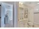 Well-lit bathroom with a shower-tub combination and a vanity with a mirror at 4328 Acorn Ct, Davenport, FL 33837