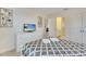 Comfortable bedroom features a large bed, TV, closet, and a doorway to a bathroom at 4328 Acorn Ct, Davenport, FL 33837