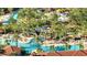 Resort-style pool area with palm trees, lounge chairs, and a thrilling water slide for endless fun and relaxation at 4328 Acorn Ct, Davenport, FL 33837