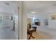Hallway leading to a living room and a bedroom, showcasing an open and connected layout at 4328 Acorn Ct, Davenport, FL 33837