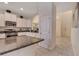 The kitchen features granite counters, stainless appliances, and an open design connecting to the dining area at 4328 Acorn Ct, Davenport, FL 33837