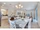 Open-concept living space flows into a dining area, showcasing modern decor, and comfortable seating at 4328 Acorn Ct, Davenport, FL 33837