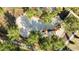 Aerial view of a fun playground surrounded by lush green trees at 4328 Acorn Ct, Davenport, FL 33837