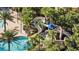 Resort-style waterpark including slide, pool, and lush landscaping at 4328 Acorn Ct, Davenport, FL 33837