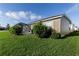 Spacious backyard with a screened-in lanai and mature landscaping at 463 Kayla Ct, The Villages, FL 32163