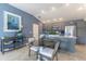 Open-concept dining area with modern furnishings and a view into the stylish kitchen at 463 Kayla Ct, The Villages, FL 32163