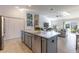 Kitchen featuring stainless steel appliances, granite countertops, and gray cabinets at 463 Kayla Ct, The Villages, FL 32163