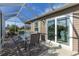 Inviting screened lanai with a glass top table, seating, and sliding glass doors, blending indoor and outdoor living at 463 Kayla Ct, The Villages, FL 32163