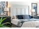 Elegantly decorated main bedroom showcasing stylish decor and a comfortable king-size bed at 463 Kayla Ct, The Villages, FL 32163