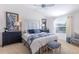 Serene main bedroom with large window, white walls and soft blue accents at 463 Kayla Ct, The Villages, FL 32163