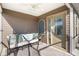 Inviting covered porch with comfortable seating and stylish decor, creating a perfect spot for relaxation and enjoying fresh air at 463 Kayla Ct, The Villages, FL 32163