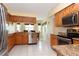 Bright kitchen boasts stainless steel appliances, granite countertops, and ample cabinet space at 4723 Saint Andrews Arc, Leesburg, FL 34748