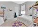 Bedroom features carpet, a bed, a purple flower rug, and wall decor at 485 Halter Dr, Apopka, FL 32712
