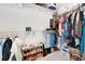 Walk-in closet with clothing racks, shelving, and neatly organized shoes at 485 Halter Dr, Apopka, FL 32712
