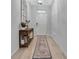 Welcoming foyer showcases tile floors, a modern light fixture, and a decorative mirror at 485 Halter Dr, Apopka, FL 32712