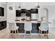 Kitchen island features stone accents, granite countertops and bar stool seating at 485 Halter Dr, Apopka, FL 32712