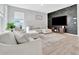 Comfortable living room features a brick accent wall, a TV, and plush seating at 485 Halter Dr, Apopka, FL 32712