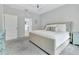 Spacious main bedroom features a tray ceiling, plush bed, and access to an ensuite bathroom at 485 Halter Dr, Apopka, FL 32712