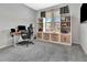 Well-lit office with built-in shelves and a desk area, offering a functional workspace in a serene environment at 485 Halter Dr, Apopka, FL 32712