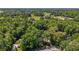 Picturesque aerial view of lush acreage with mature trees, and beautiful community homes at 4920 Sw 4Th Cir, Ocala, FL 34471