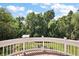 Backyard view from a brick patio with greenery, mature trees, and a grassy yard at 4920 Sw 4Th Cir, Ocala, FL 34471