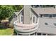 Exterior of home with second-story balcony, white railing, and lots of natural light at 4920 Sw 4Th Cir, Ocala, FL 34471