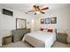 Cozy bedroom features neutral decor, a ceiling fan, and stylish artwork at 4920 Sw 4Th Cir, Ocala, FL 34471