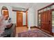Elegant entryway featuring hardwood floors, wooden accents, and stylish decor at 4920 Sw 4Th Cir, Ocala, FL 34471