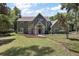 Charming two-story home featuring a well-manicured lawn, covered porch, and inviting front entrance at 4920 Sw 4Th Cir, Ocala, FL 34471